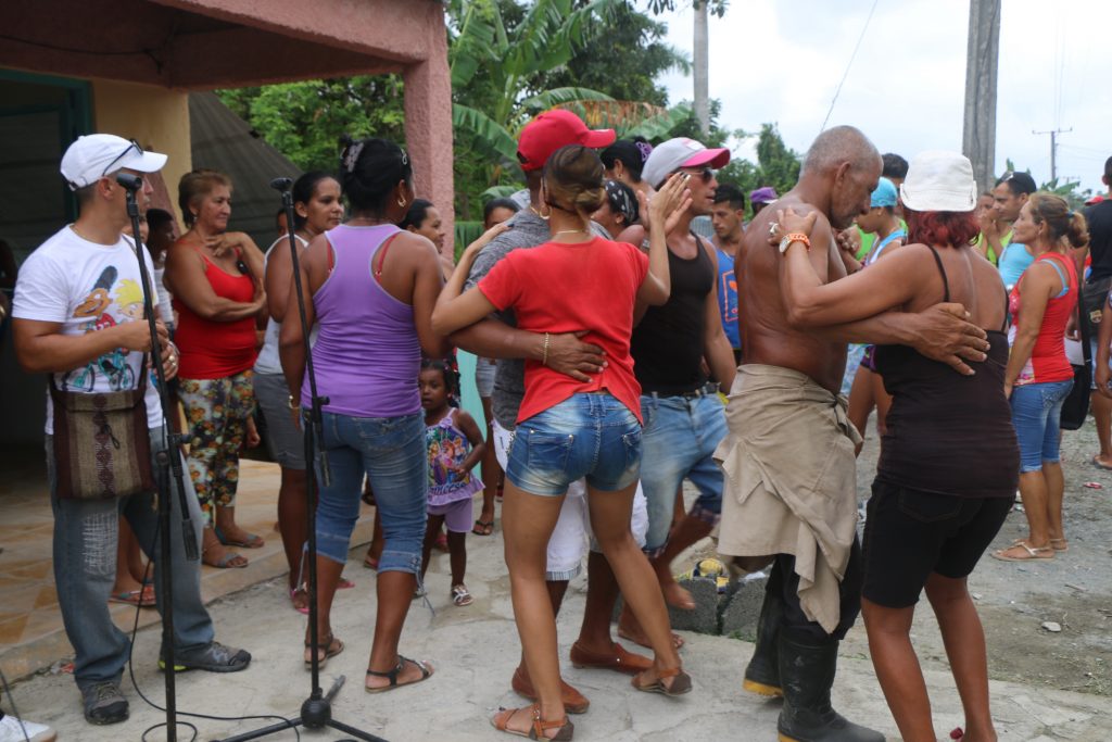 Local residents dance to the music of Loly y sus Atrevidos de la Bachata